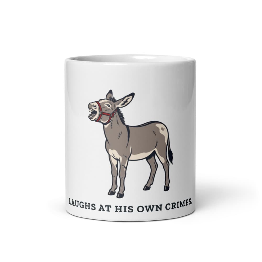 Ceramic mug with cartoon Jonah the donkey braying, captioned about laughing at his own crimes.